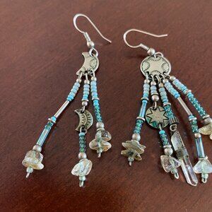 Handcrafted silver and crystal beaded sun and moon earrings.